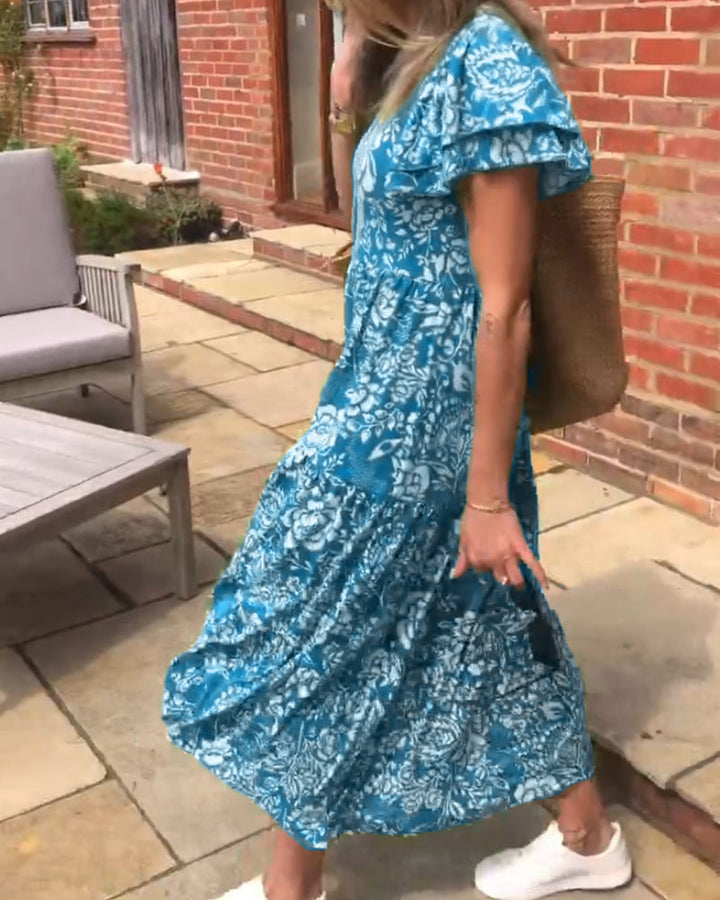 ModeHuis® | Lange jurk met korte mouwen en bloemenprint