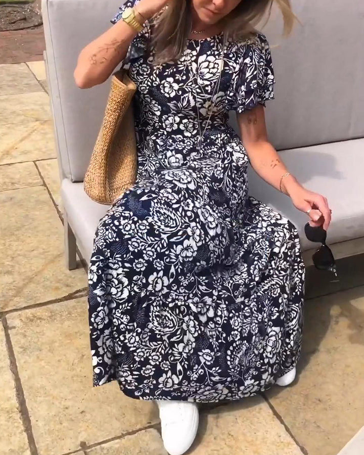 ModeHuis® | Lange jurk met korte mouwen en bloemenprint