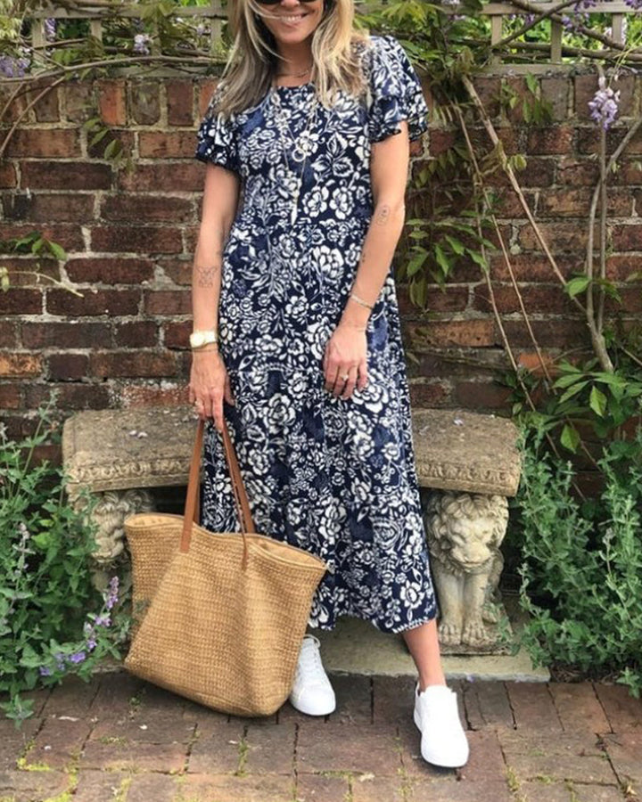 ModeHuis® | Lange jurk met korte mouwen en bloemenprint
