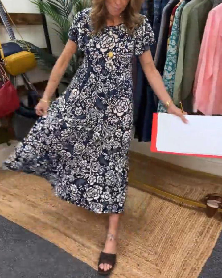 ModeHuis® | Lange jurk met korte mouwen en bloemenprint