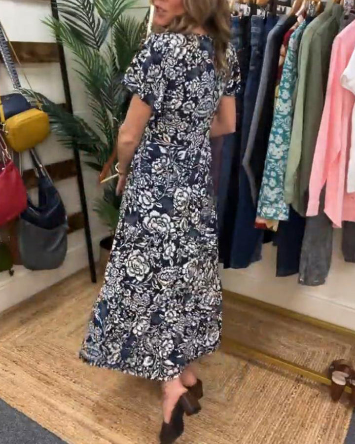 ModeHuis® | Lange jurk met korte mouwen en bloemenprint